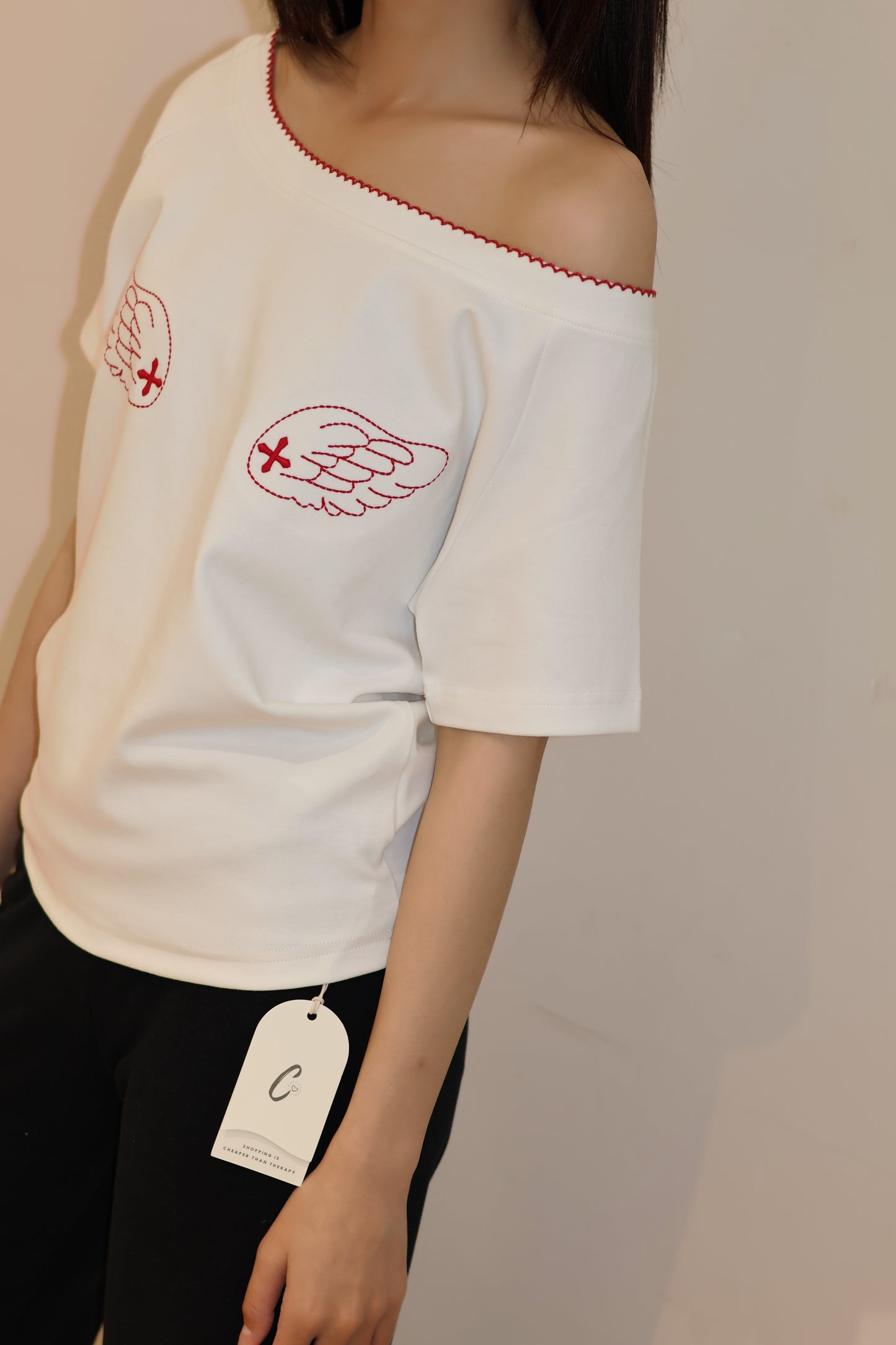 ANGEL GRAPHIC HALF SHOULDER TOP