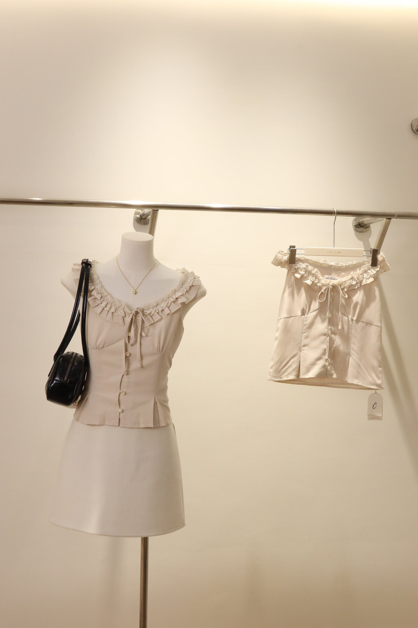 Cream ruffled neck top