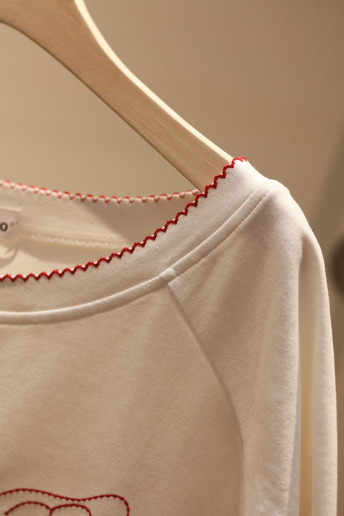 ANGEL GRAPHIC HALF SHOULDER TOP