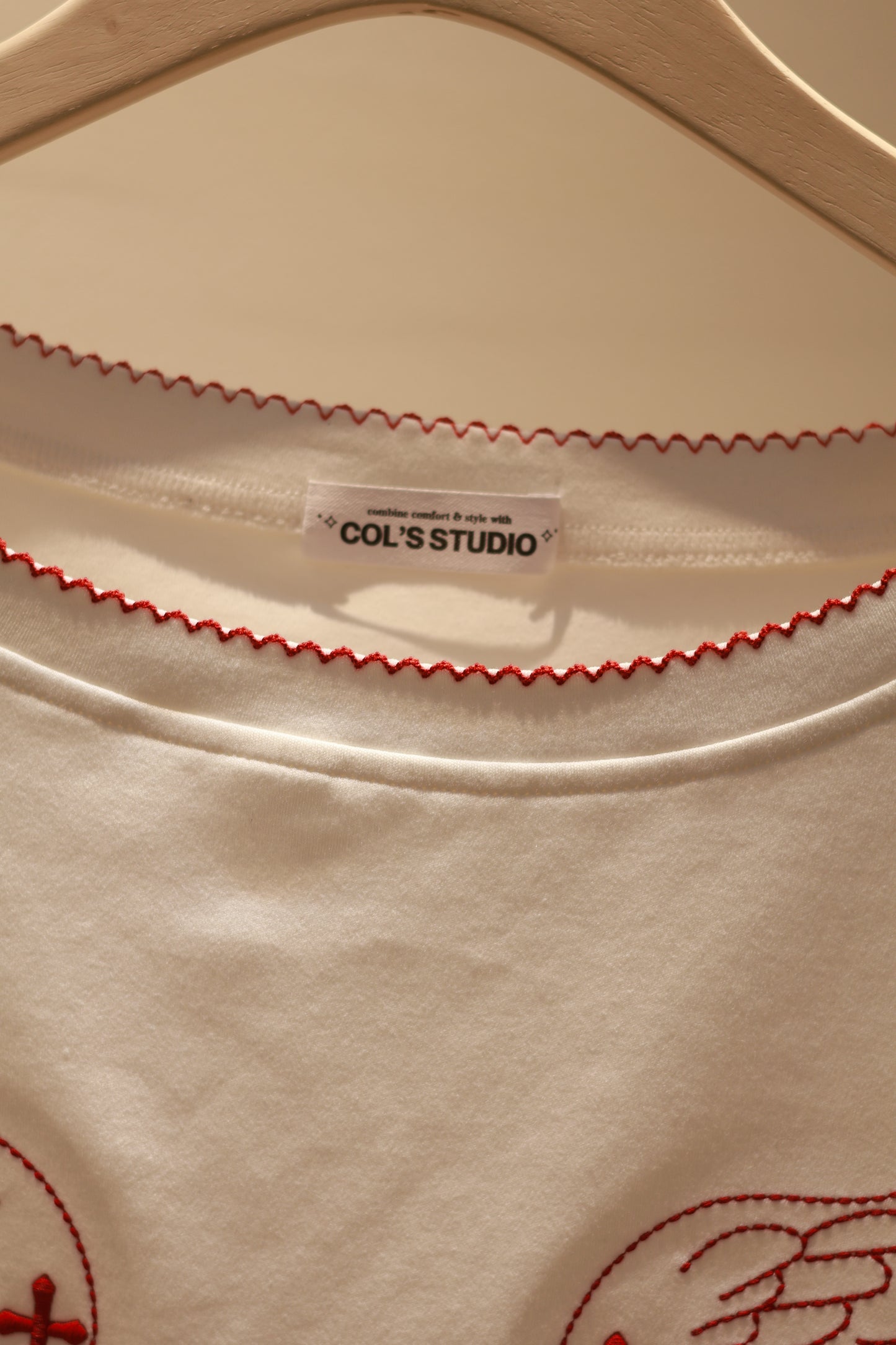 ANGEL GRAPHIC HALF SHOULDER TOP