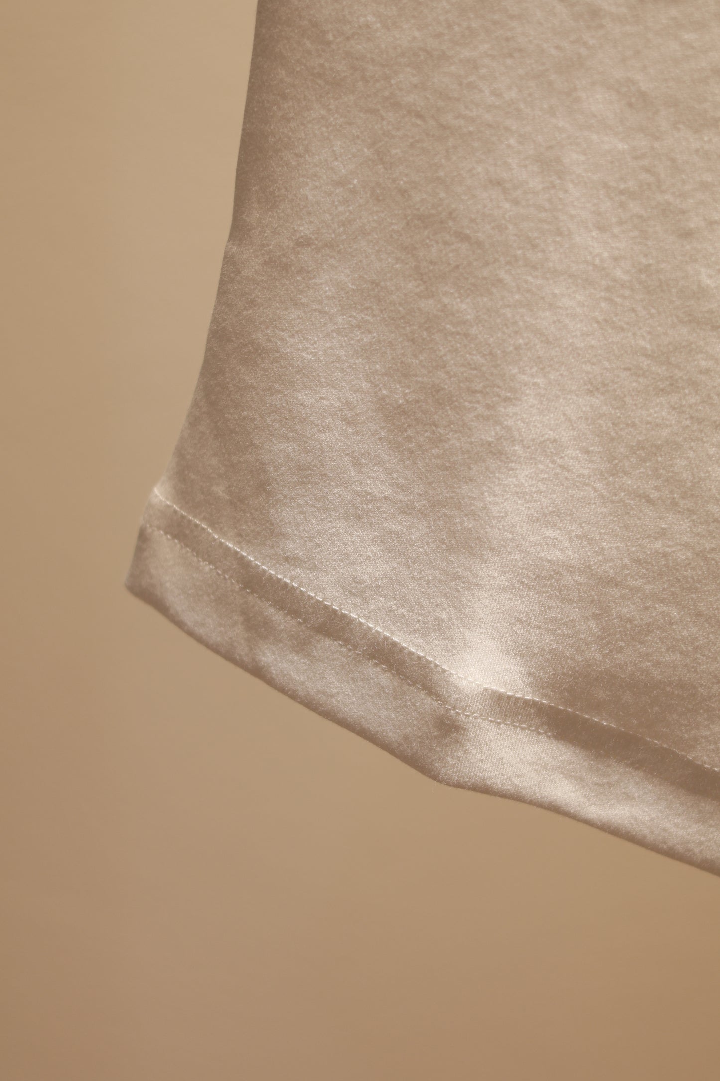 ANGEL GRAPHIC HALF SHOULDER TOP