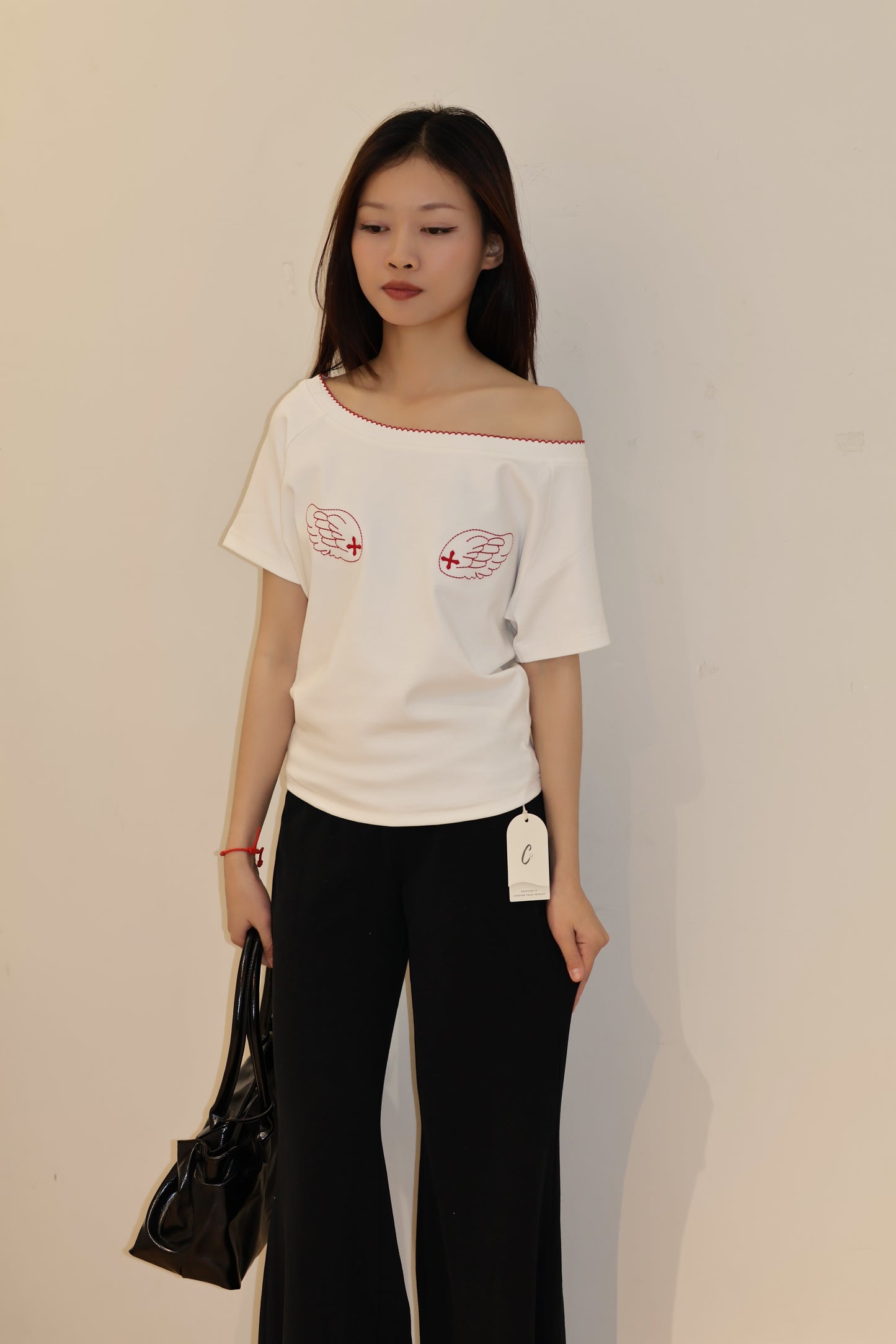 ANGEL GRAPHIC HALF SHOULDER TOP
