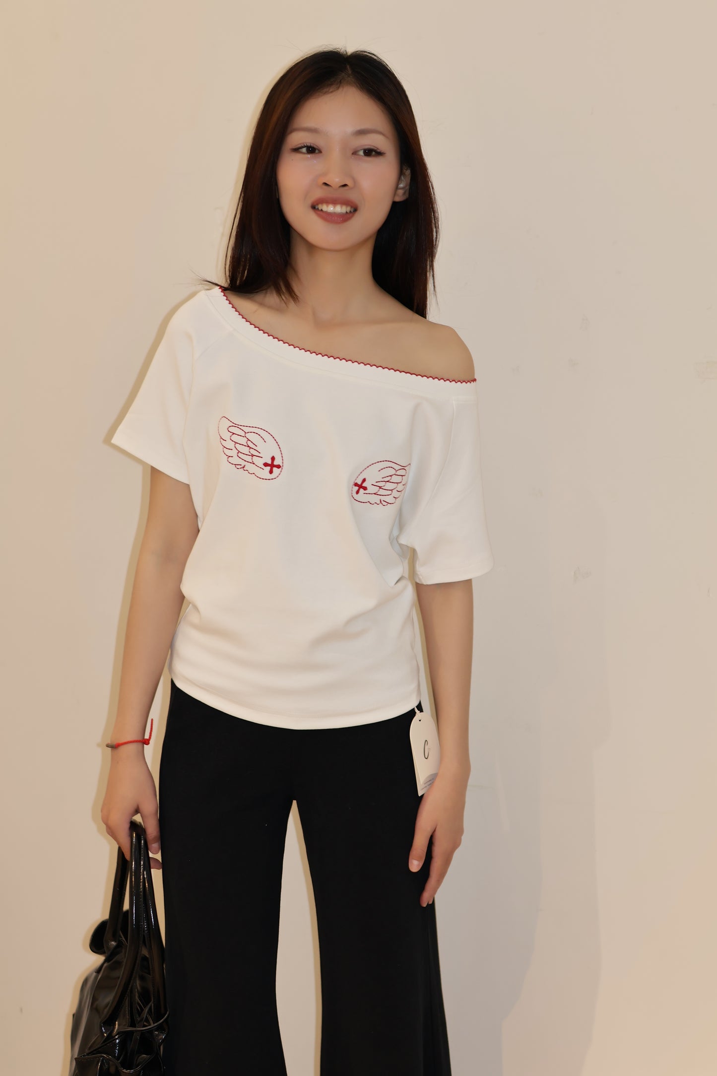 ANGEL GRAPHIC HALF SHOULDER TOP