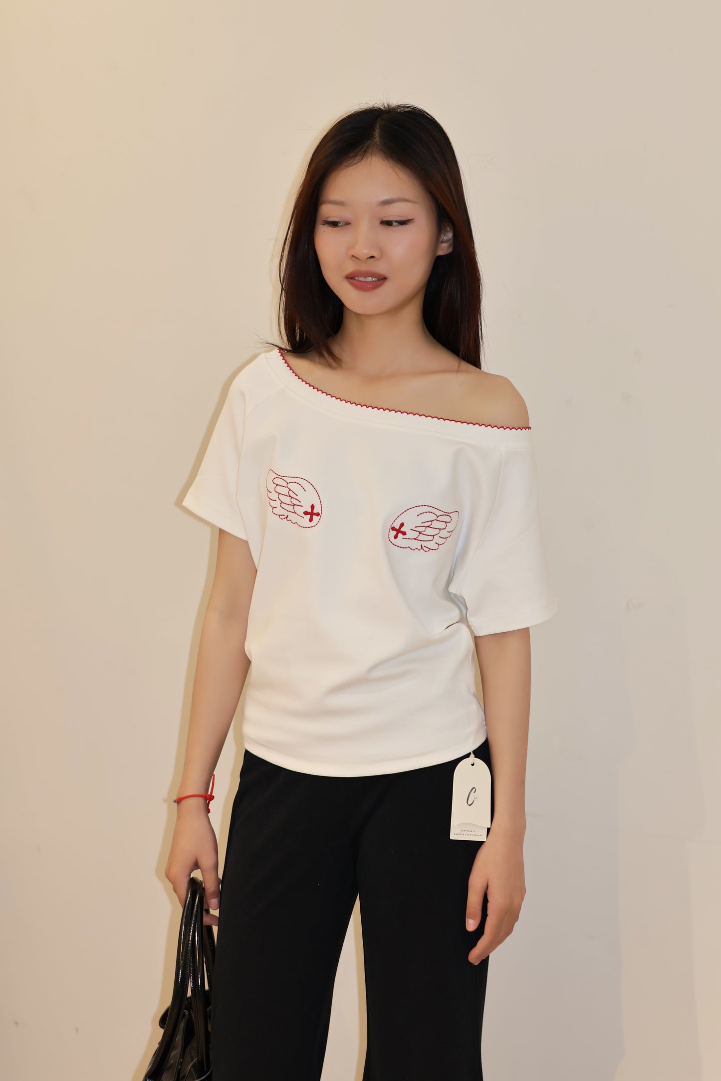 ANGEL GRAPHIC HALF SHOULDER TOP