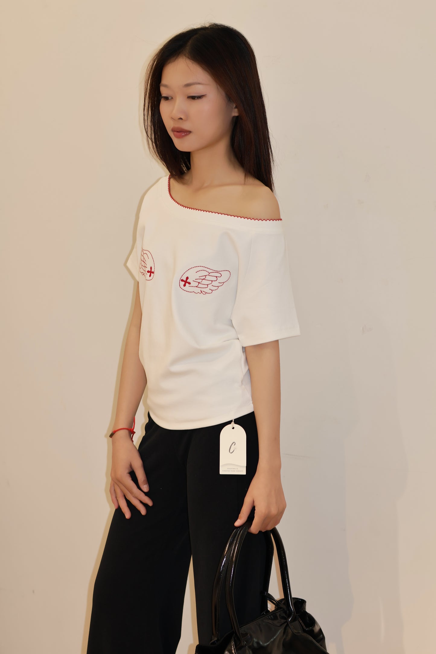 ANGEL GRAPHIC HALF SHOULDER TOP