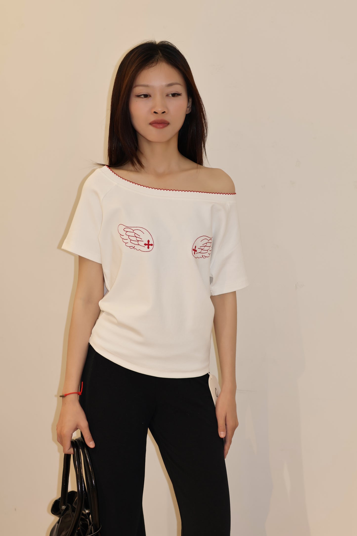 ANGEL GRAPHIC HALF SHOULDER TOP