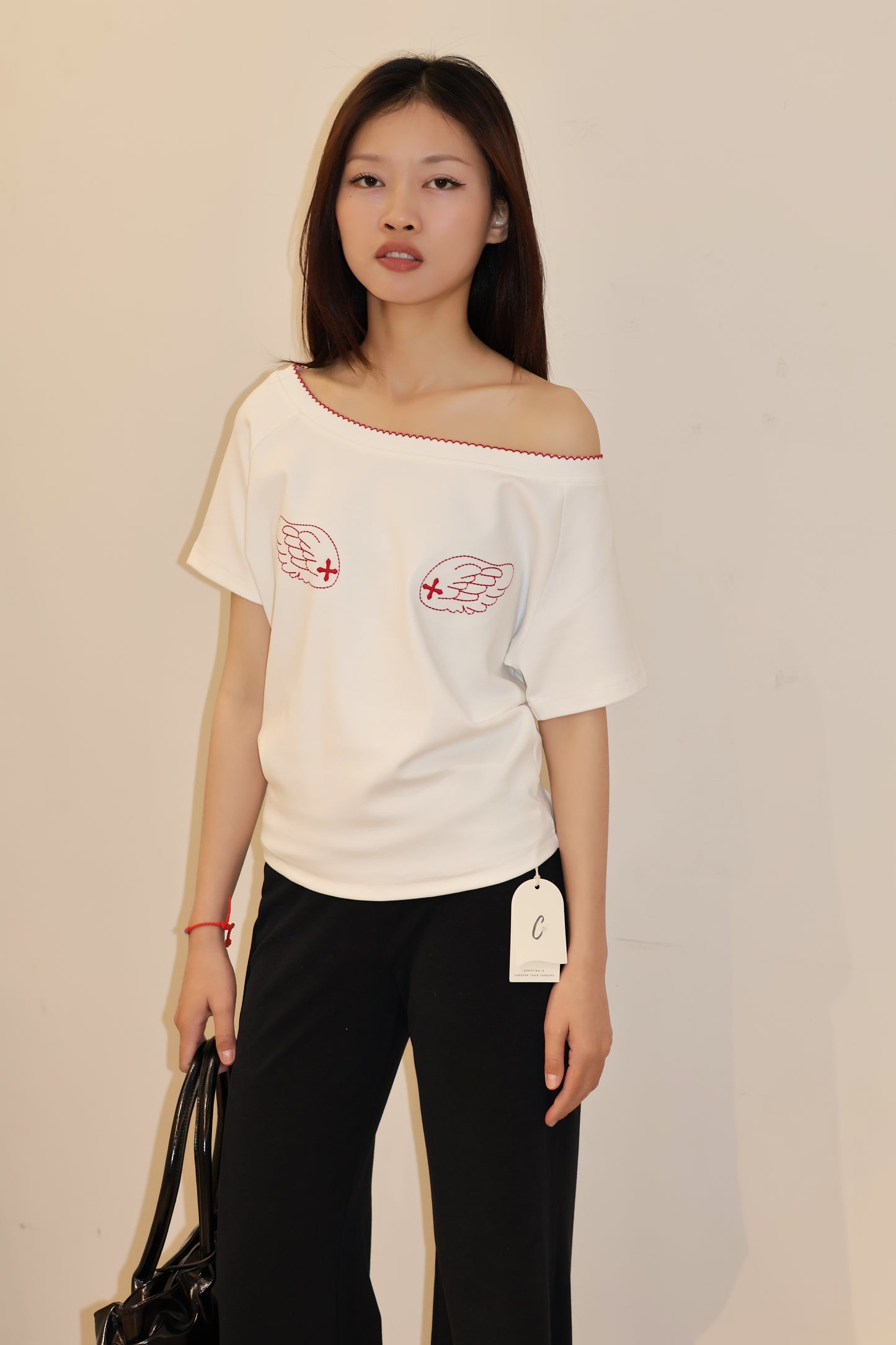 ANGEL GRAPHIC HALF SHOULDER TOP