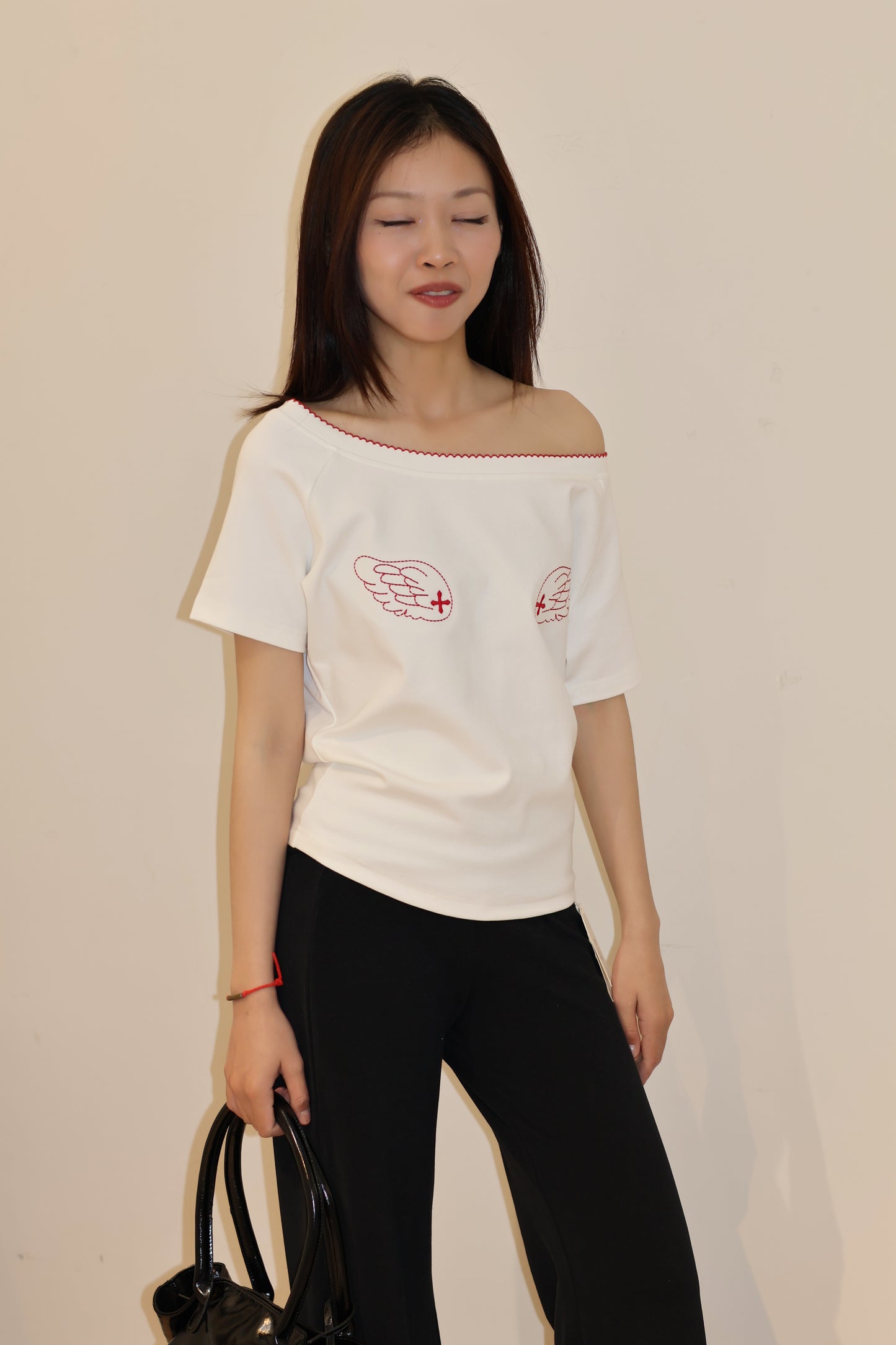 ANGEL GRAPHIC HALF SHOULDER TOP