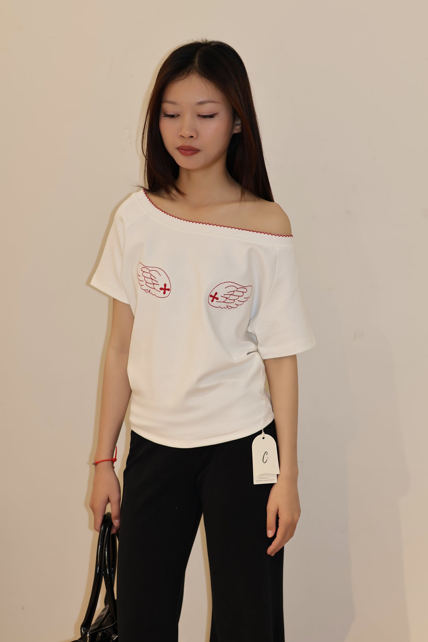 ANGEL GRAPHIC HALF SHOULDER TOP