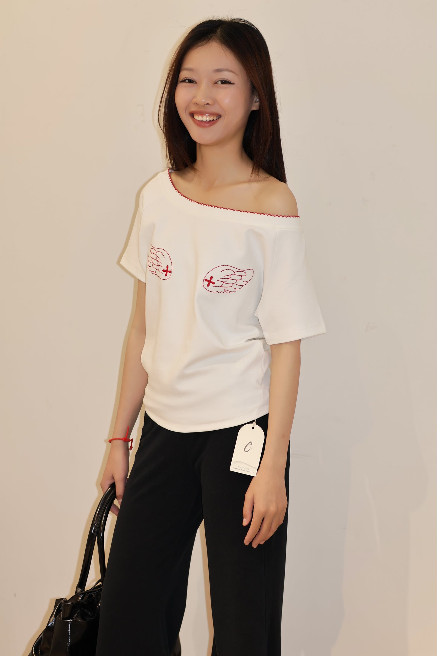 ANGEL GRAPHIC HALF SHOULDER TOP