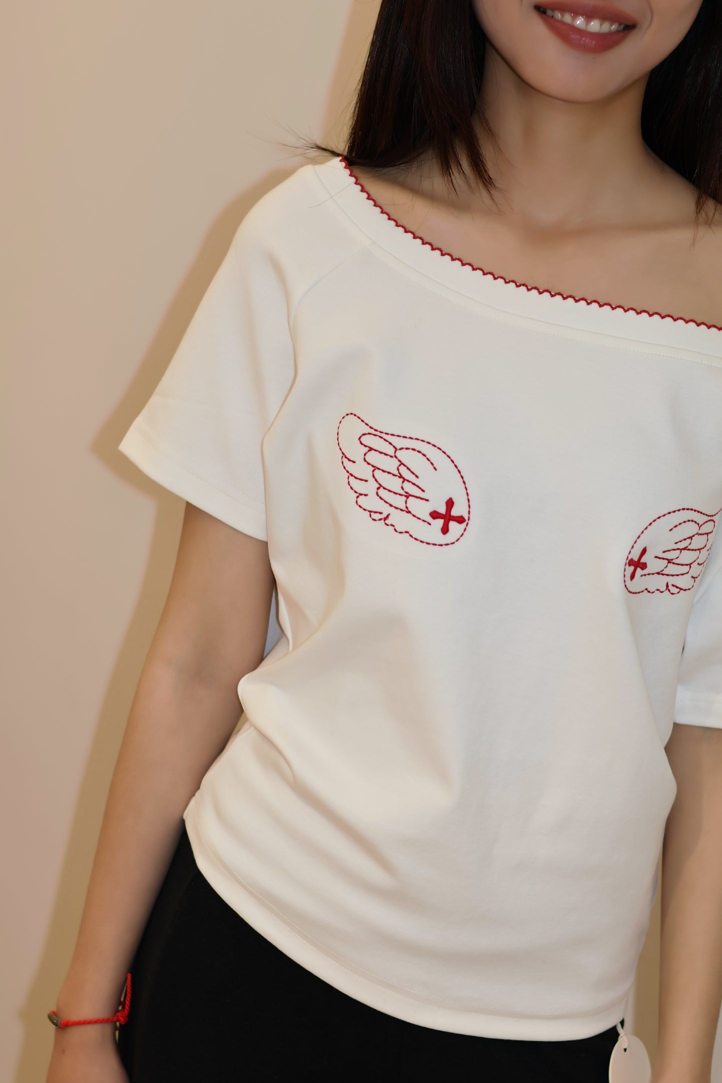 ANGEL GRAPHIC HALF SHOULDER TOP
