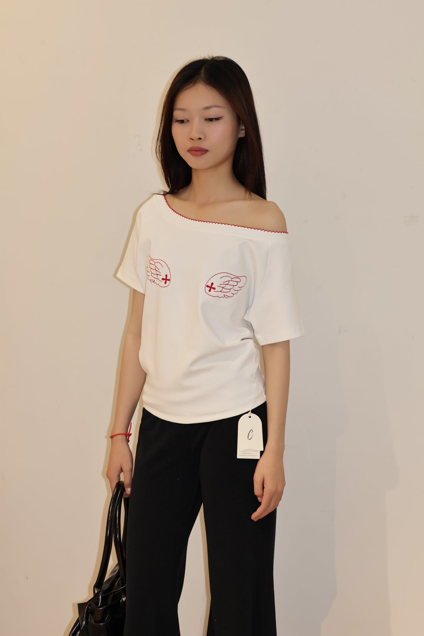 ANGEL GRAPHIC HALF SHOULDER TOP