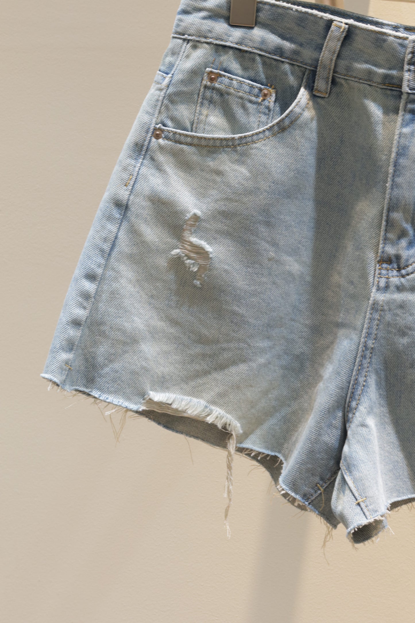 J3 distressed denim shorts