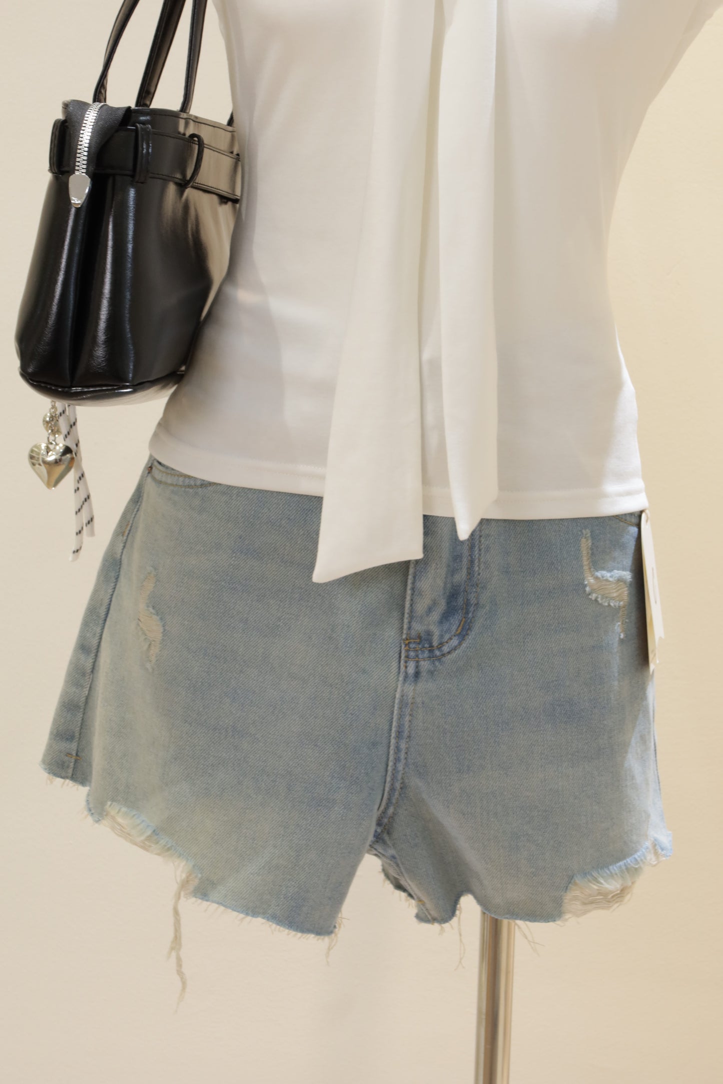 J3 distressed denim shorts