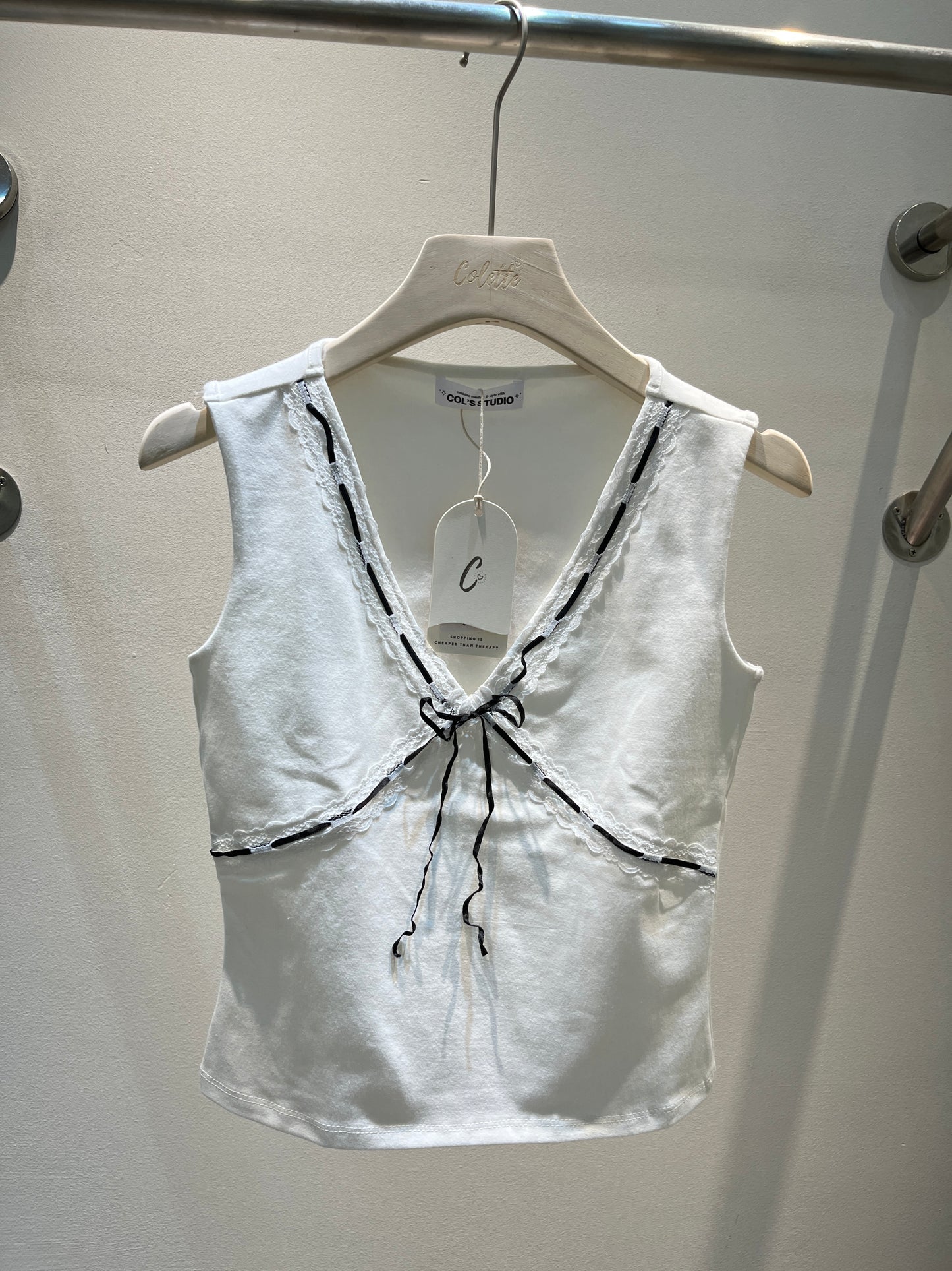 White top with black ribbon