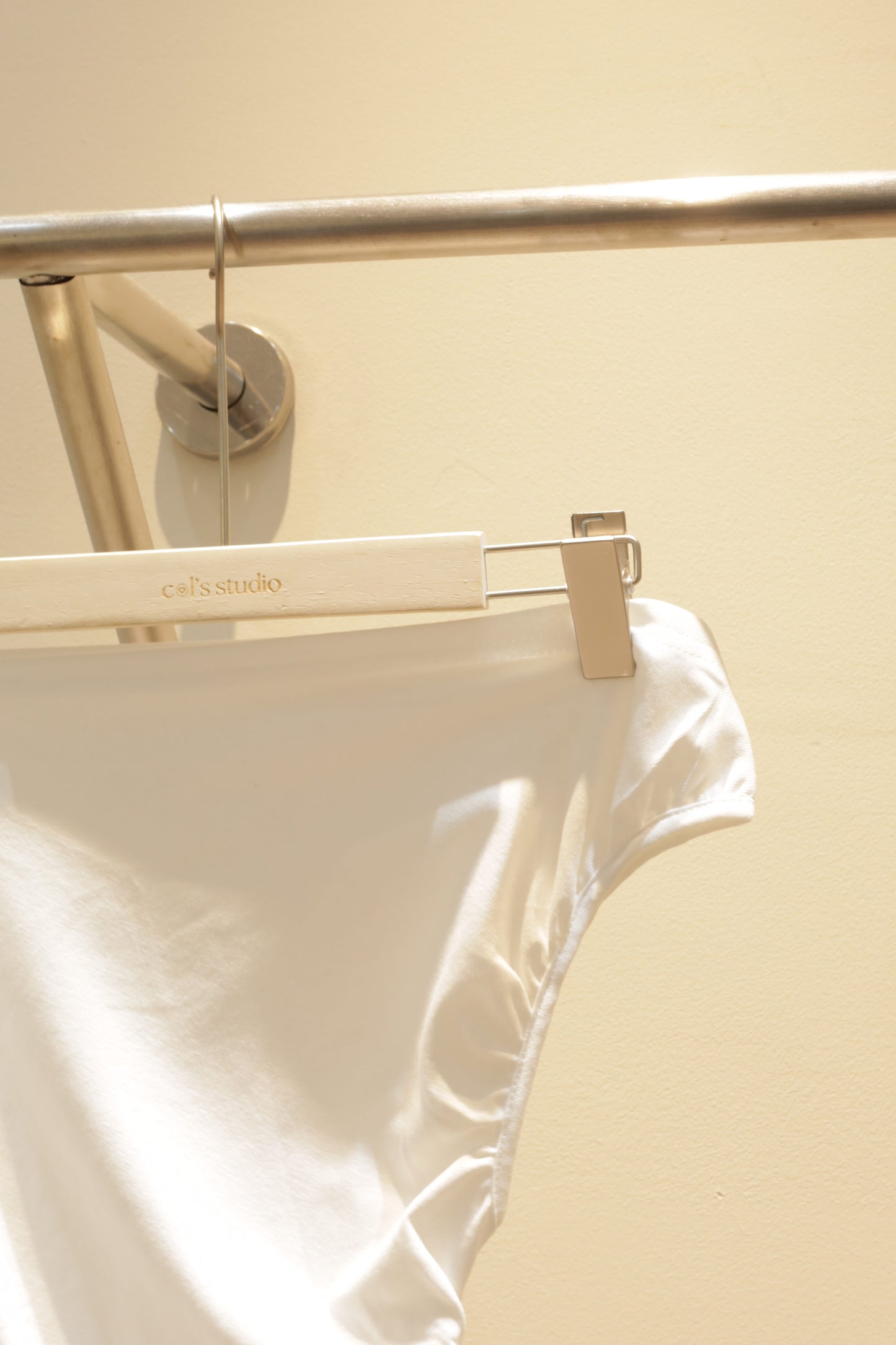 White waist cinch off shoulder